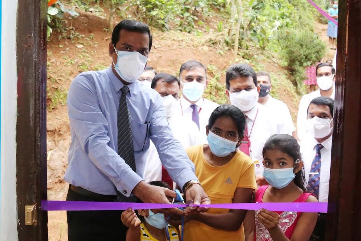 People&#039;s Bank Buddhist Society hands over the newly renovated home to a low-income family in Muruthalawa